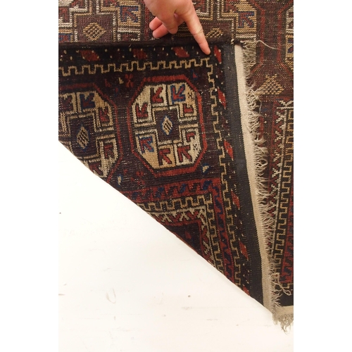 113 - A dark ground Bokhara style prayer rug