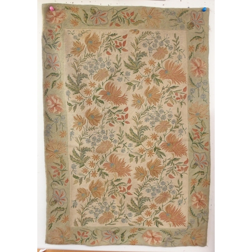 115 - A beige ground floral pattern rug with flower head border