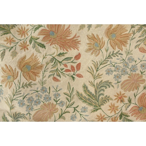 115 - A beige ground floral pattern rug with flower head border