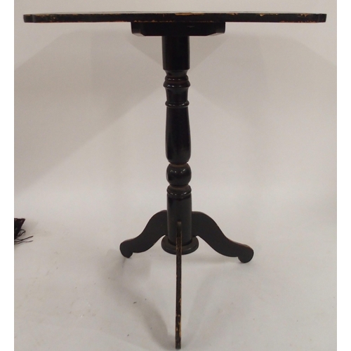 134 - A 19th century ebonised Oriental occasional table on tripod base