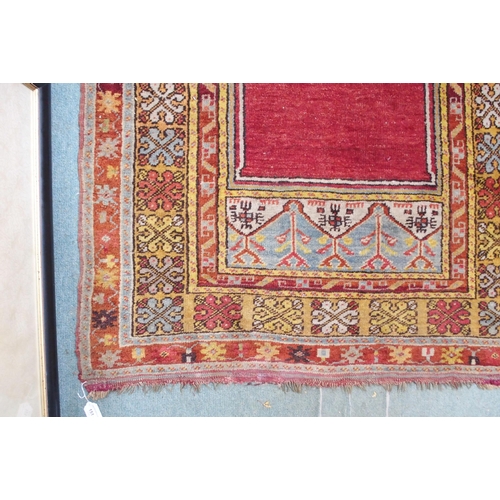 151 - A red ground Persian prayer rug with multicoloured border