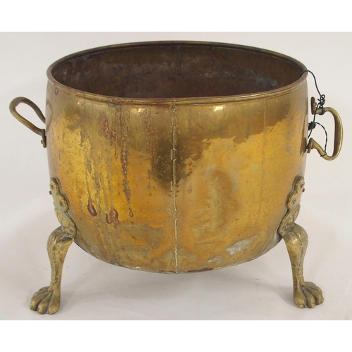 16 - A 19th century brass log bin with twin riveted handles on three paw feet