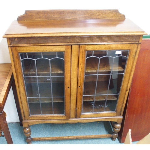 167 - A 20th century oak leaded glass bookcase and a mahogany occasional table (2)