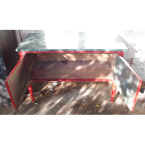 170 - An early 20th century red painted arts and crafts marble topped washstand with pair of cabinet doors... 