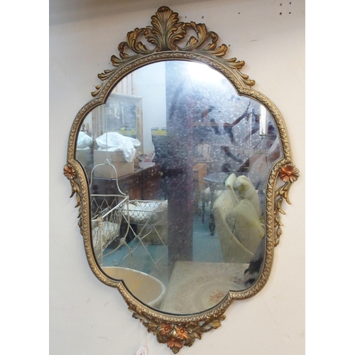 178 - A 20th century gilt metal framed rococo style wall mirror