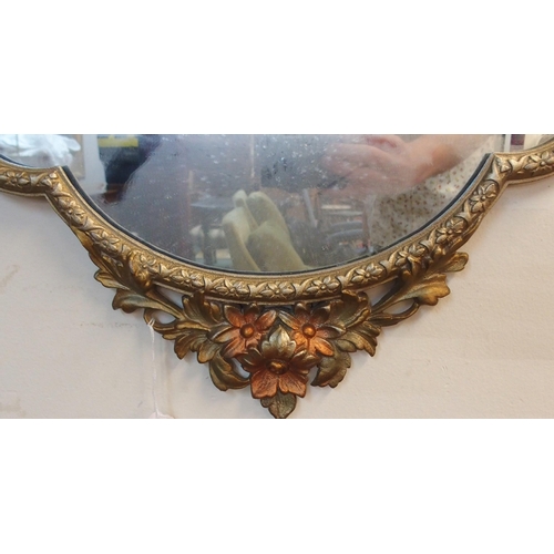 178 - A 20th century gilt metal framed rococo style wall mirror