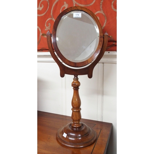 179 - A Victorian mahogany framed oval shaving mirror on pedestal base