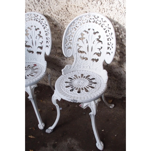 181 - A 20th century cast metal garden table and four accompanying chairs (5)