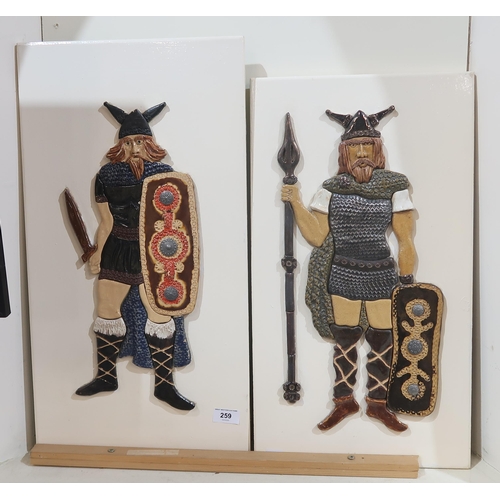 259 - *WITHDRAWN* Two Cuchulain Ceramic panels, each depicting a Viking Warrior