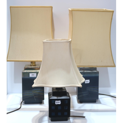 260 - A pair of Margery Clinton table lamps and another lamp by the same hand