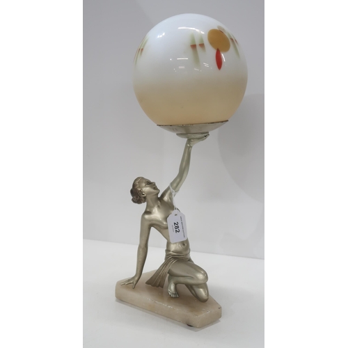 282 - An Art Deco lamp modelled as figure of a woman holding a globe shade