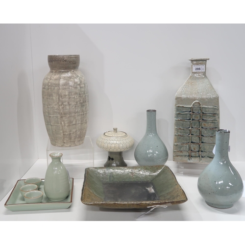 286 - A collection of Korean ceramics including vases, lidded pot, sake set and squared dish