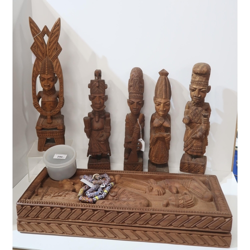 290 - A collection of African carved wood figures, a board game, string of glass beads and a hat