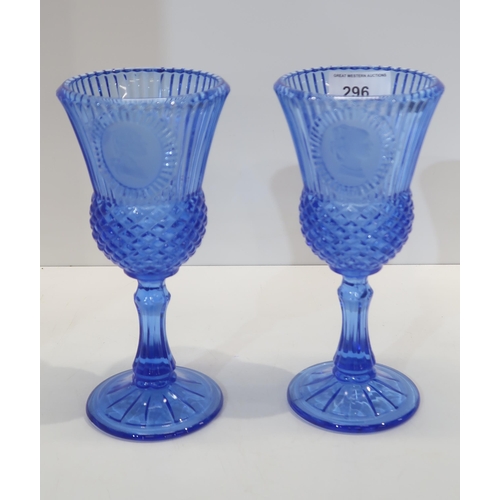 296 - A pair of Avon Fostoria blue glass goblets, depicting George and Martha Washington