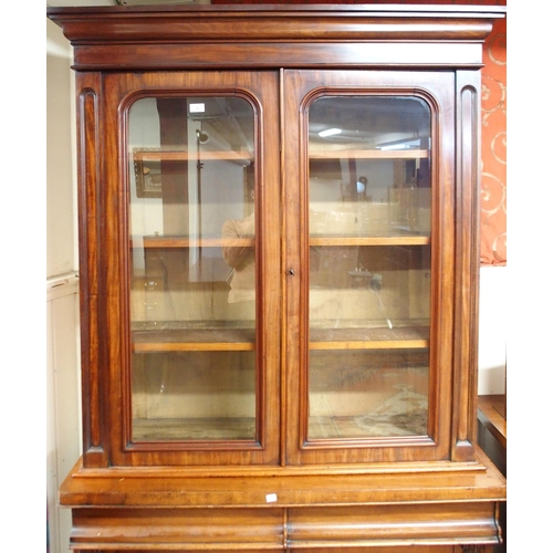 30 - A Victorian glazed bookcase with shaped cornice over pair of glazed doors over pair of drawers over ... 