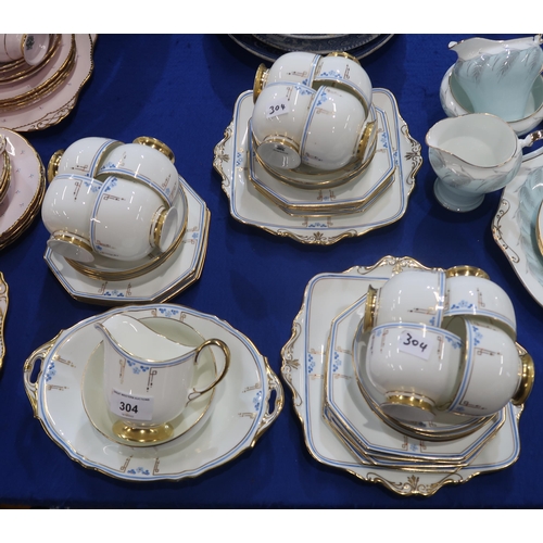 304 - An Art Deco Paragon teaset, the white ground with blue flowers and gilt stylised decoration comprisi... 