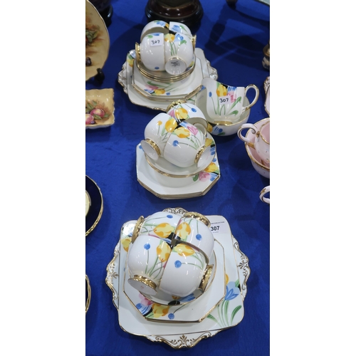 307 - An Art Deco Paragon teaset painted with crocuses, comprising eleven cups, twelve saucers and plates,... 