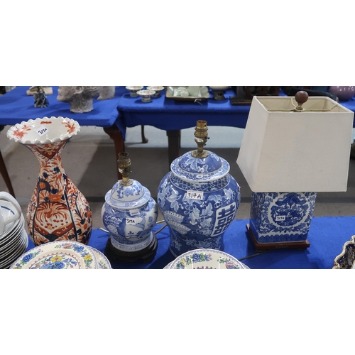 317a - Three Chinese blue and white lamps and an Imari vase