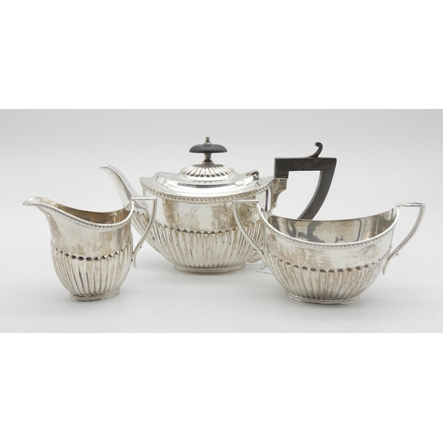 326 - A George V Bachelors silver tea service, the bodies fluted, the rims gadrooned, by James Deakin &... 