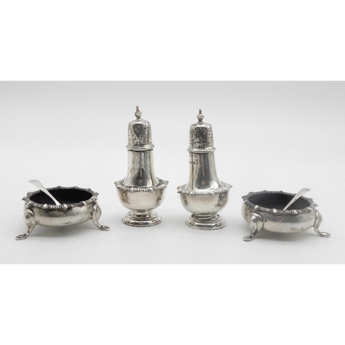 329 - A four piece silver cruet set, comprising a pair of baluster form casters and a pair of open salts, ... 