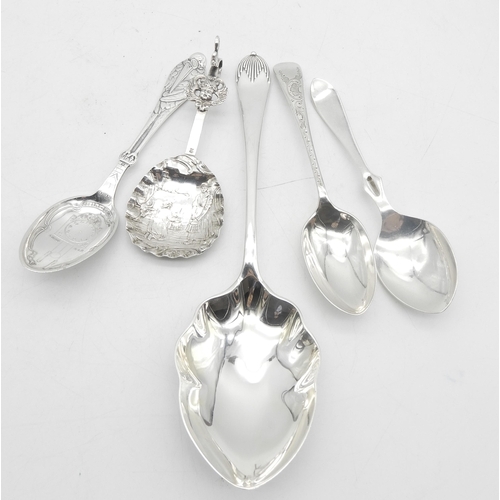 332 - A collection of silver spoons including a silver serving spoon, the bowl lobed, by Walker & Hall... 