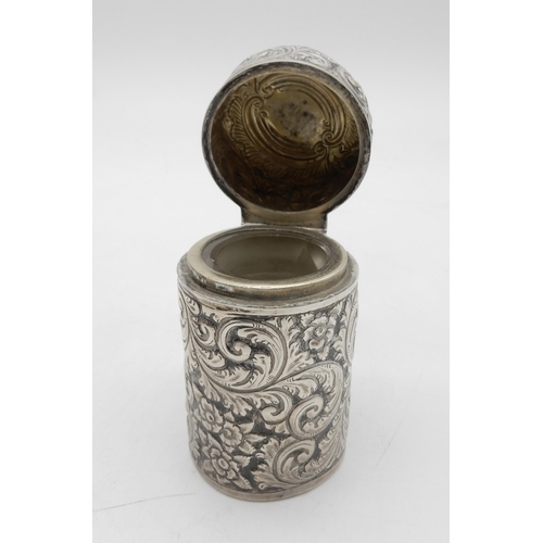 339 - A Victorian silver and glass inkwell, of circular form, with scrolling foliate decoration, the lid w... 