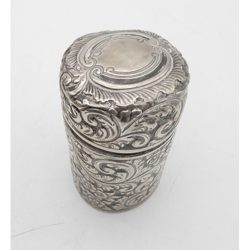 339 - A Victorian silver and glass inkwell, of circular form, with scrolling foliate decoration, the lid w... 