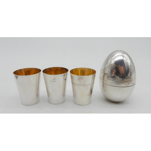 341A - A collection of silver and EPNS including a Japanese silver sake set modelled as an egg, the body wi... 