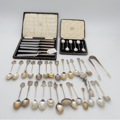 348 - A collection of silver flatware including silver souvenir spoons, most with UK hallmarks, some white... 