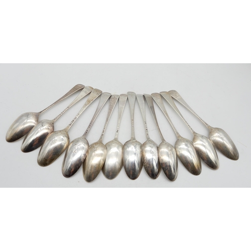 355 - A matched set of twelve George III silver scroll-back Hanoverian pattern dessert spoons, the reverse... 