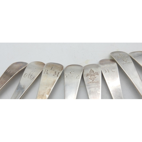 355 - A matched set of twelve George III silver scroll-back Hanoverian pattern dessert spoons, the reverse... 