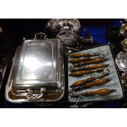 359 - A collection of EPNS including a cased canteen of cutlery, EPNS entree dishes, a swing handled baske... 