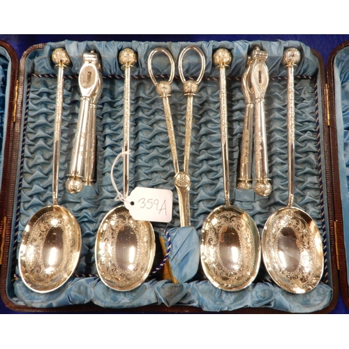 359A - A cased EPNS nut cracker, grape scissor and serving spoon set, with embossed scrolling foliate decor... 