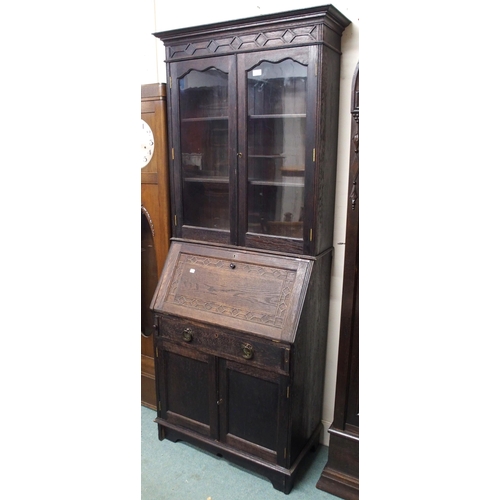 4 - A 20th century stained oak bureau bookcase with glazed two door bookcase top over fall front writing... 