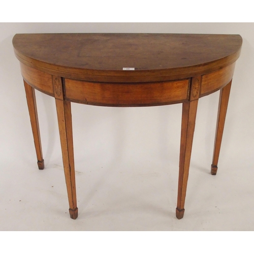 66 - A Victorian mahogany demi lune fold over tea table with single drawer on square tapering supports