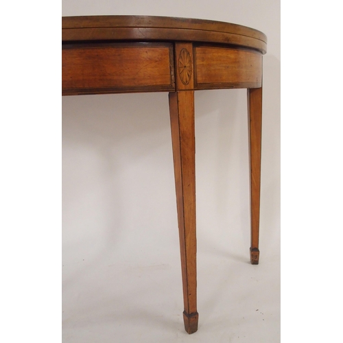 66 - A Victorian mahogany demi lune fold over tea table with single drawer on square tapering supports