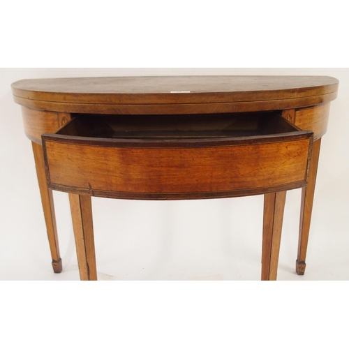 66 - A Victorian mahogany demi lune fold over tea table with single drawer on square tapering supports