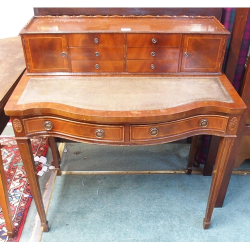 67 - A 20th century mahogany ladies writing desk with fitted superstructure over embossed leather skiver ... 