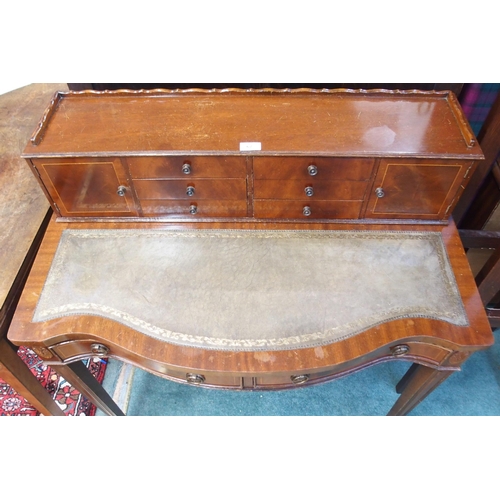 67 - A 20th century mahogany ladies writing desk with fitted superstructure over embossed leather skiver ... 