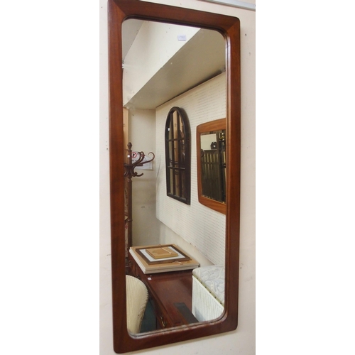 71 - A lot of two mid 20th century teak framed wall mirrors and a further 20th century wall mirror (3)