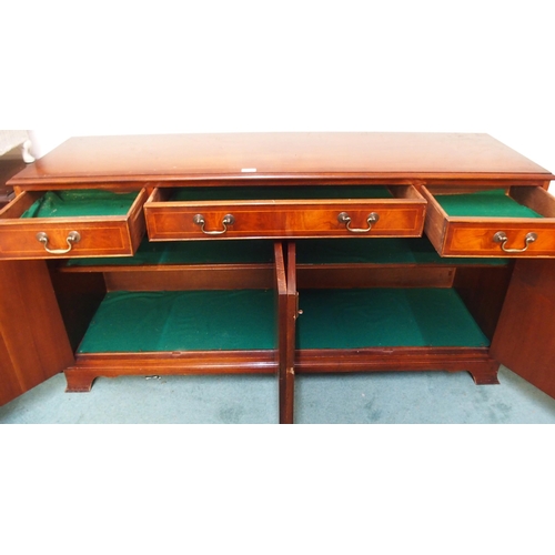 73 - A 20th century mahogany four door sideboard