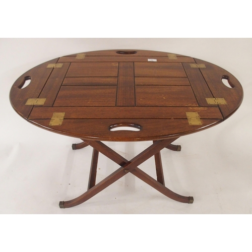 77 - A 20th century mahogany butler tray and stand with drop sides