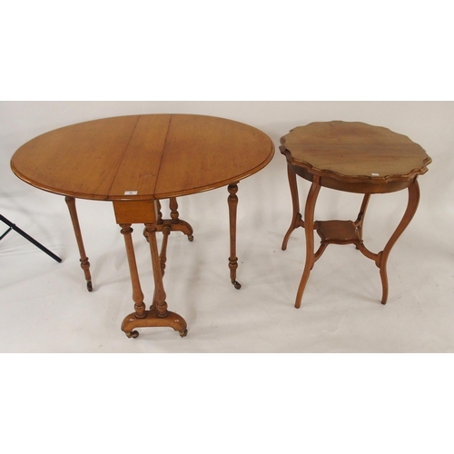 78 - A Victorian mahogany drop leaf table with stretchered turned supports and a mahogany two tier window... 