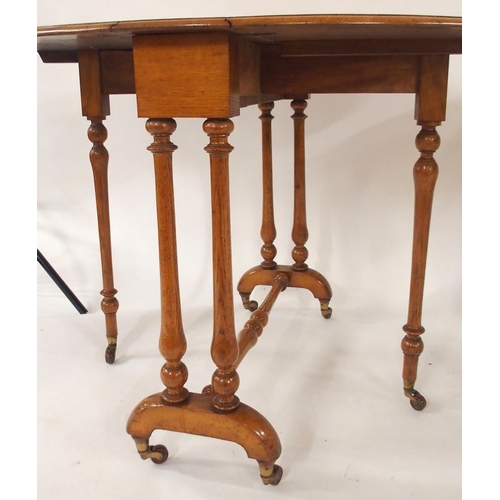 78 - A Victorian mahogany drop leaf table with stretchered turned supports and a mahogany two tier window... 