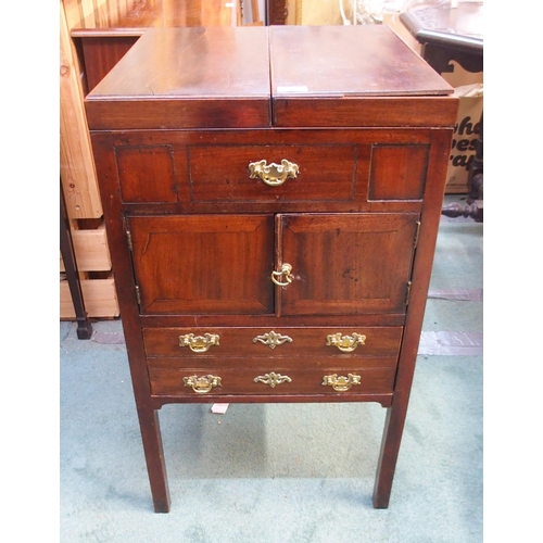 79 - A 19th century mahogany commode with twin hinged lid over pair of cabinet doors over single drawer o... 