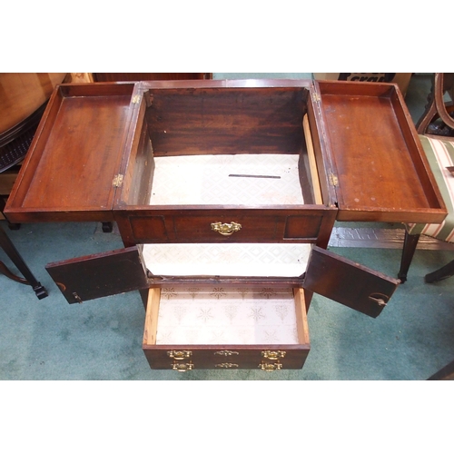 79 - A 19th century mahogany commode with twin hinged lid over pair of cabinet doors over single drawer o... 