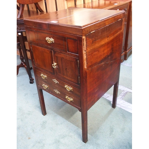 79 - A 19th century mahogany commode with twin hinged lid over pair of cabinet doors over single drawer o... 