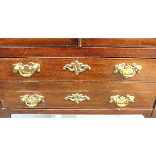 79 - A 19th century mahogany commode with twin hinged lid over pair of cabinet doors over single drawer o... 