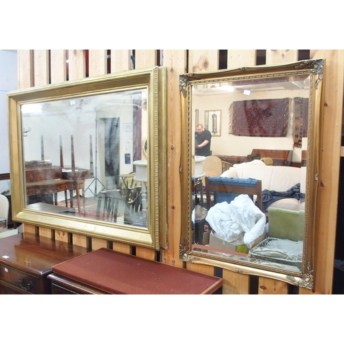 81 - A 20th century gilt framed wall mirror and another smaller gilt framed bevelled glass wall mirror (2... 