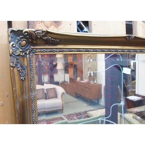 81 - A 20th century gilt framed wall mirror and another smaller gilt framed bevelled glass wall mirror (2... 